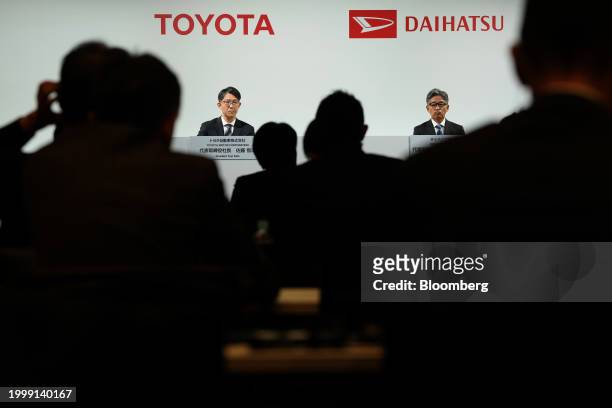 Koji Sato, president of Toyota Motor Corp., left, and Masahiro Inoue, incoming chief executive officer of Daihatsu Motor Co., attend a news...