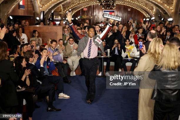 Jon Batiste performs on the runway at the Tommy Hilfiger fashion show during New York Fashion Week The Shows on February 09, 2024 in New York City.