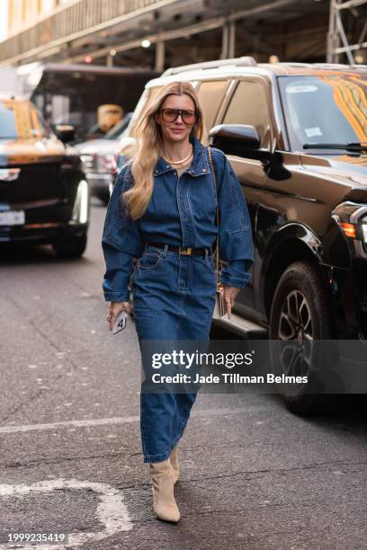 Guest is seen wearing a denim top, skirt and cream boots outside the Prabal Gurung show during New York Fashion Week at Starrett-Lehigh on February...