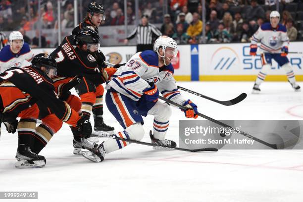 Urho Vaakanainen, Radko Gudas and Troy Terry of the Anaheim Ducks defend against of the Edmonton Oilers during the first period of a game at Honda...