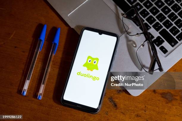 The Duolingo logo is being displayed on a smartphone screen in Athens, Greece, on February 13, 2024.