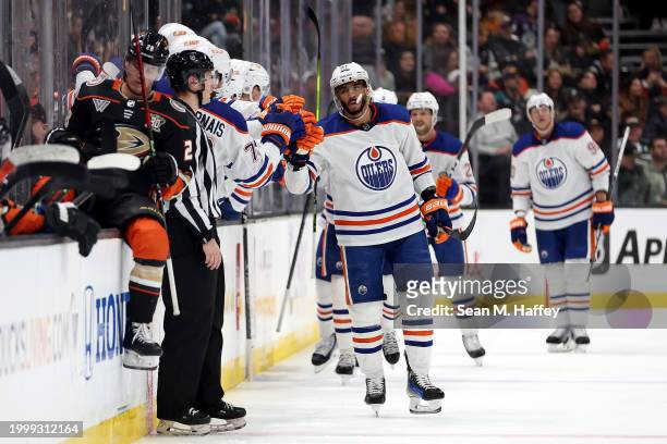 Evander Kane of the Edmonton Oilers is congratulated at the bench after scoring his second goal during the second period of a game against the...