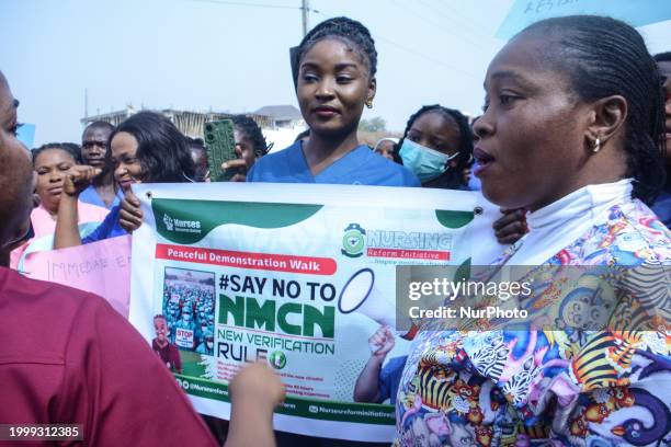 Nurses and midwives are conducting their protest against the Federal Government's new verification certification guideline in Abuja, Nigeria, on...