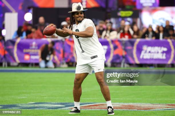 Former NFL quarterback Cam Newton attempts a pass during a celebrity flag football game at the Mandalay Bay Convention Center on February 09, 2024 in...