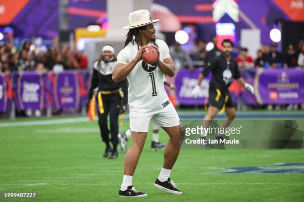 Former NFL quarterback Cam Newton attempts a pass during a celebrity flag football game at the Mandalay Bay Convention Center on February 09, 2024 in...