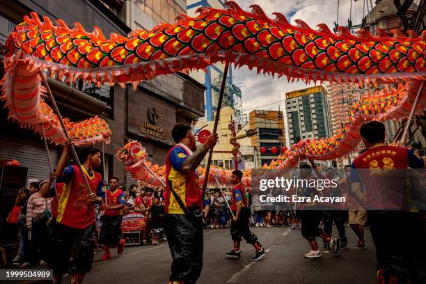 Dragon dancers perform during Lunar New Year celebrations at Binondo district, considered the world's oldest Chinatown, on February 10, 2024 in...