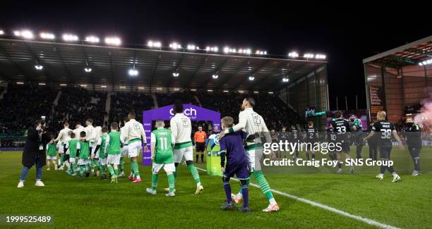 The players enter the pitch before a cinch Premiership match between Hibernian and Celtic at Easter Road Stadium, on February 07 in Edinburgh,...