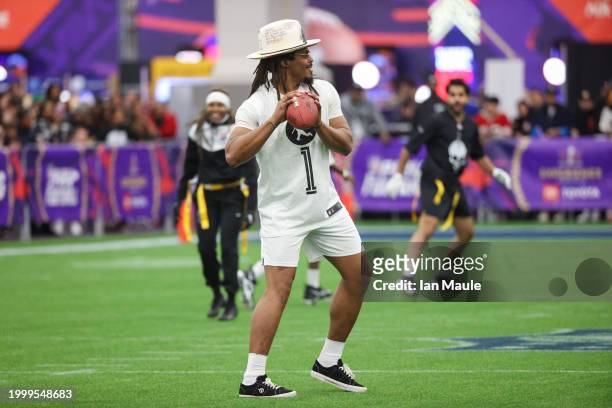 Former NFL quarterback Cam Newton attempts a pass during a celebrity flag football game at the Mandalay Bay Convention Center on February 09, 2024 in...