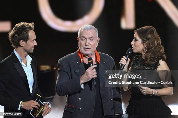 Bernard Lavilliers receives a Special Honour award next to Master of Ceremony TV host Cyril Feraud and Master of Ceremony TV host Lea Salame during...