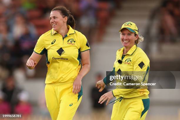 Tahlia McGrath of Australia celebrates with Beth Mooney of Australia after dismissing Marizanne Kapp of South Africa during game three of the women's...