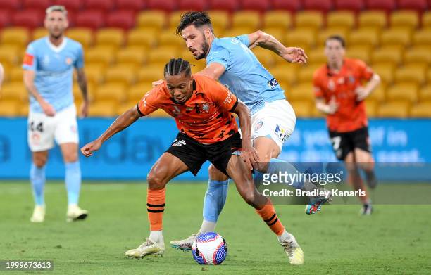 Antonee Burke-Gilroyo of the Roar is challenged by Matthew Leckie of Melbourne City during the A-League Men round 16 match between Brisbane Roar and...