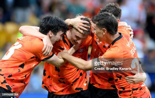 Thomas Waddingham of the Roar celebrates with team mates after scoring a goal during the A-League Men round 16 match between Brisbane Roar and...