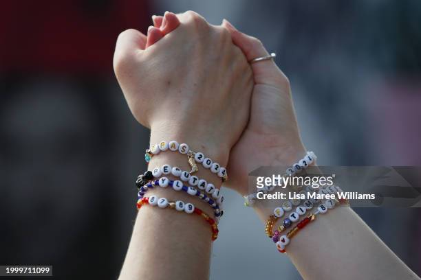 Fans are seen wearing friendship bracelets at The Taylor Swift Countdown Clock on February 10, 2024 in Sydney, Australia. The Taylor Swift Countdown...