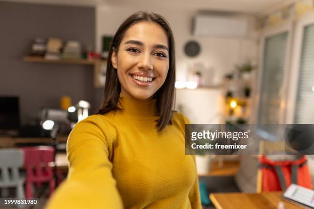 beautiful young woman taking selfie at home - woman selfie portrait stock pictures, royalty-free photos & images