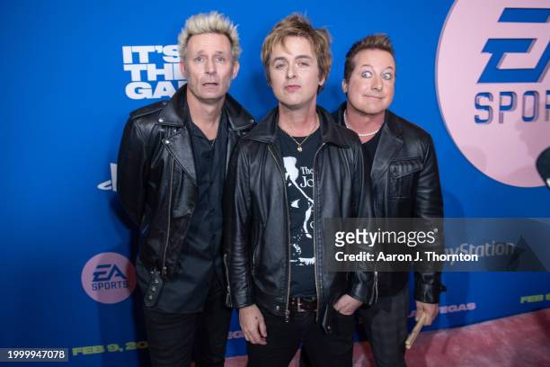 Green Day members Mike Dirnt, Billie Joe Armstrong, and Tre Cool attend the EA Sports Madden Bowl at the House of Blues Las Vegas on February 09,...