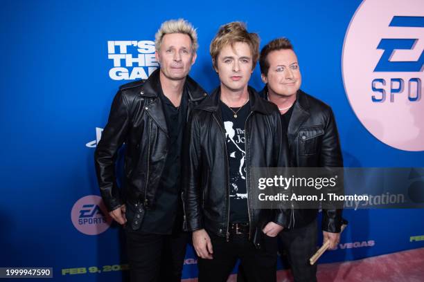 Green Day members Mike Dirnt, Billie Joe Armstrong, and Tre Cool attend the EA Sports Madden Bowl at the House of Blues Las Vegas on February 09,...
