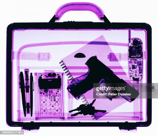 x-ray image of briefcase containing hand gun - xray bag stock pictures, royalty-free photos & images