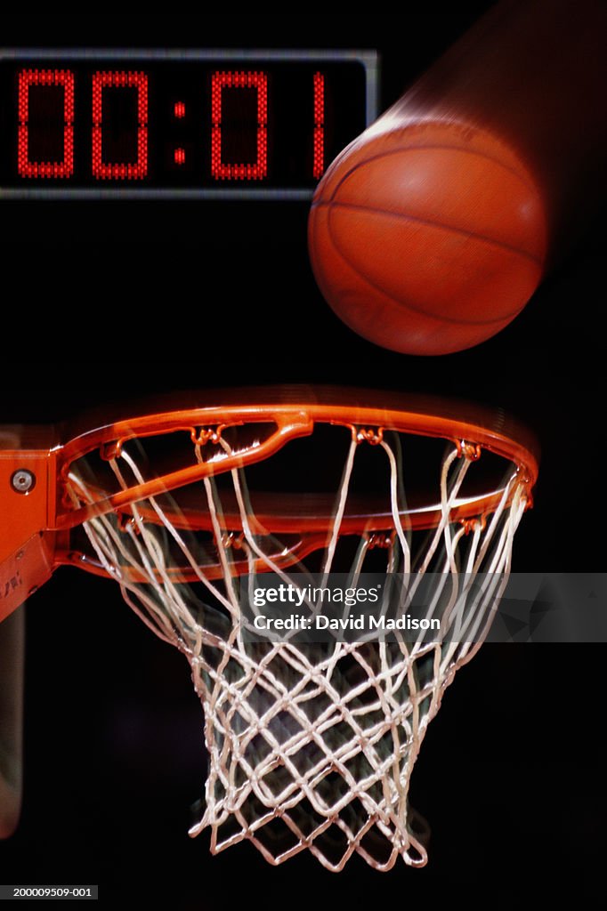Basketball falling into basket (blurred motion)