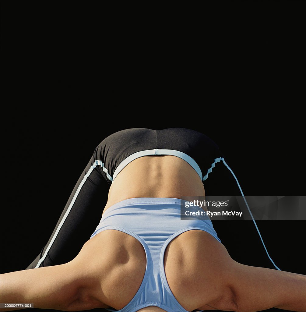 Woman stretching, focus on back