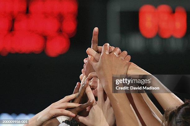 women basketball team celebrating victory, close-up of hands - sportteam stockfoto's en -beelden