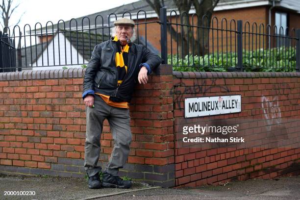 Wolverhampton Wanderers fan poses for a photo prior to the Premier League match between Wolverhampton Wanderers and Brentford FC at Molineux on...