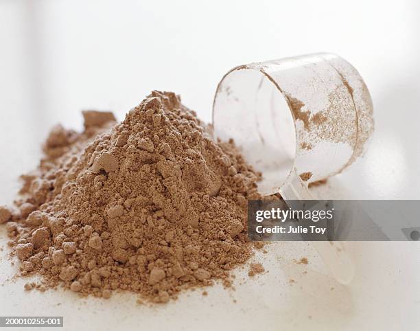 protein powder and measuring cup - food additive stock pictures, royalty-free photos & images