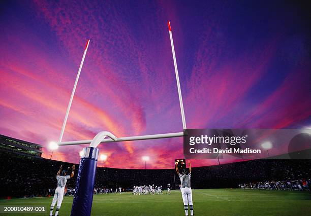 referees signaling field goal at american football game, sunset - football goal post stock pictures, royalty-free photos & images