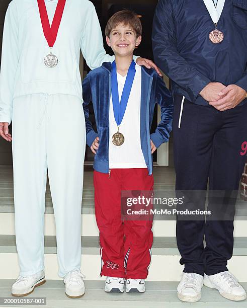 family wearing medals, mid section - awards ceremony sports stock pictures, royalty-free photos & images