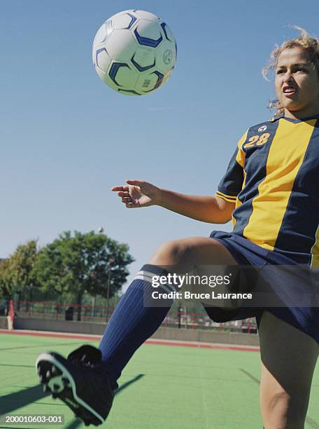 teenage girl (12-14) kicking soccer ball - amateur stock pictures, royalty-free photos & images