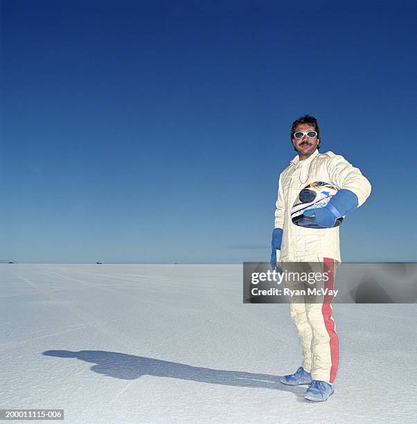 usa, utah, bonneville salt flats, racecar driver standing on raceway - race driver stock-fotos und bilder