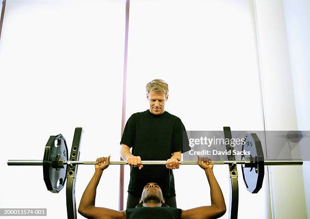 man lifting weight with spotter - spotting bildbanksfoton och bilder