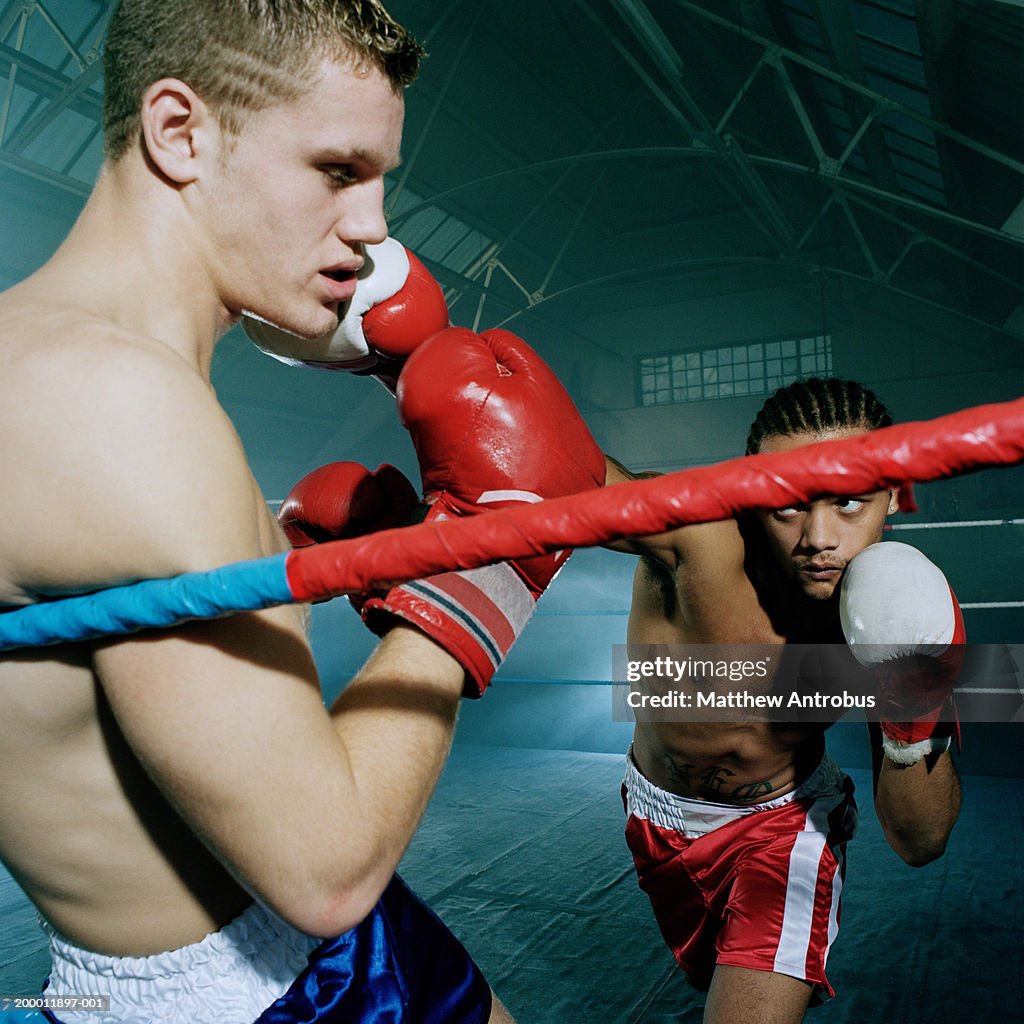 Boxer hitting opponent, close-up