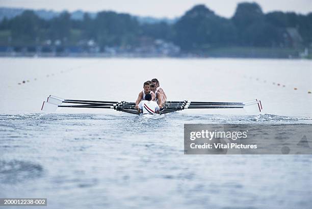 england, london, river thames, rowing crew in boat - canottaggio foto e immagini stock