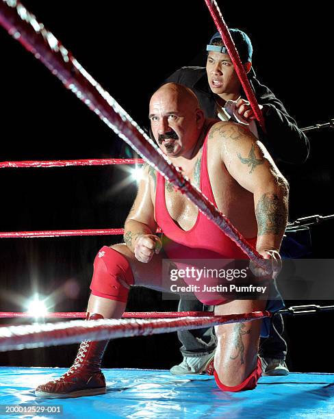 male wrestler and assistant in corner of ring - mixed wrestling imagens e fotografias de stock