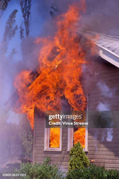 wooden house burning - burning house stock pictures, royalty-free photos & images