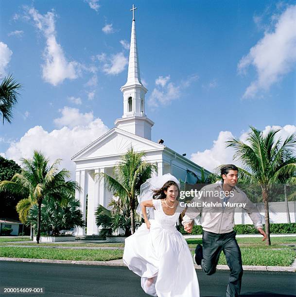 bride running away from church with young man - 映画調 ストックフォトと画像