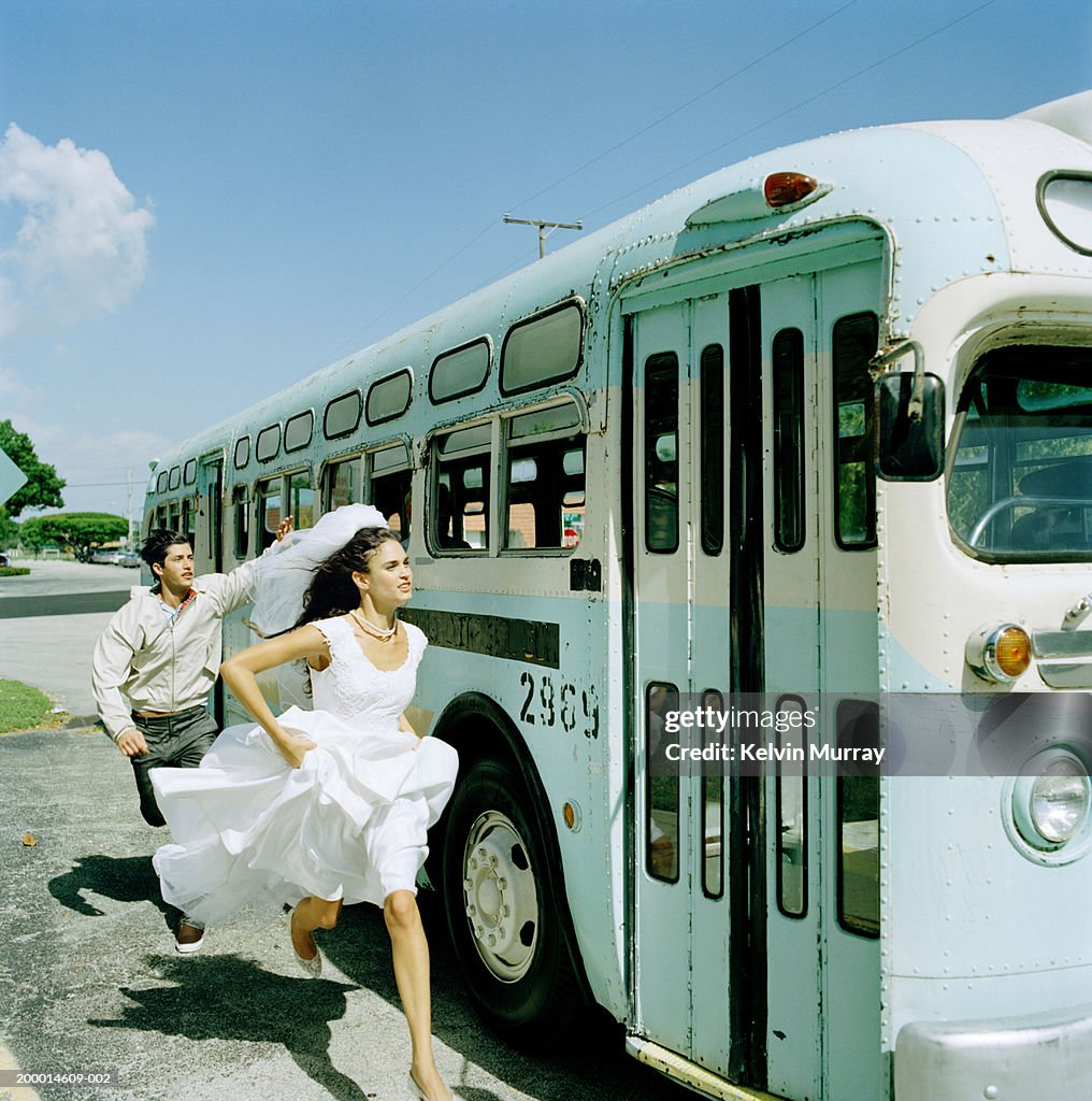 Bride and young man running to catch bus