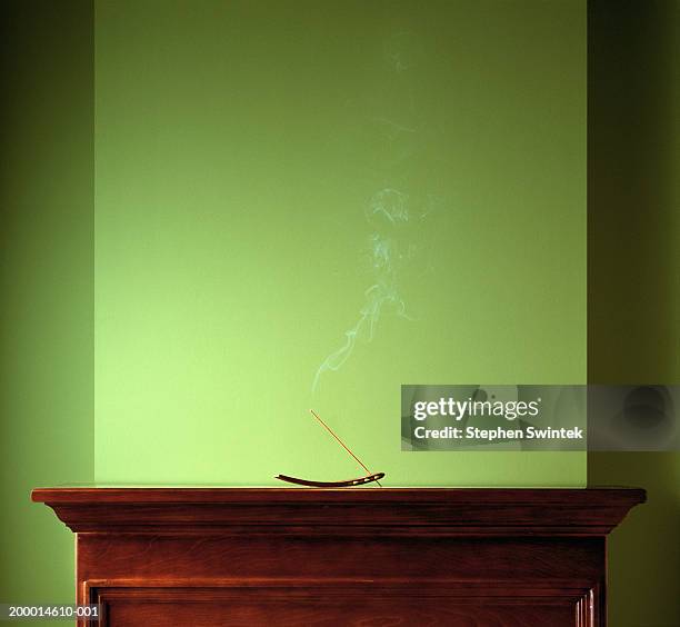 incense stick burning on mantle - mantelpiece stock pictures, royalty-free photos & images