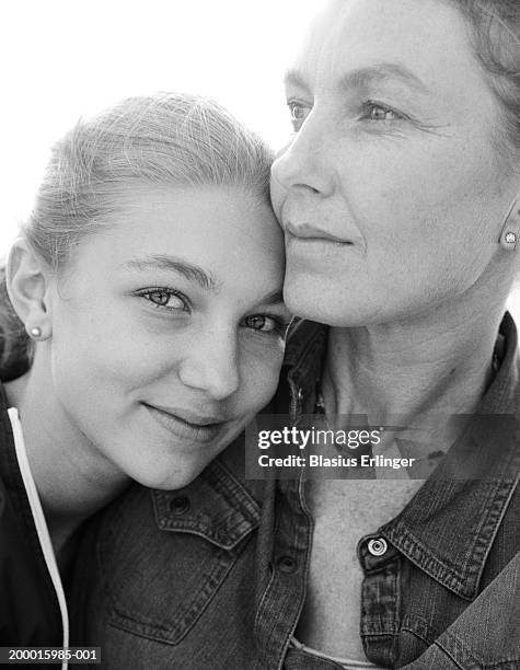 mother and teenage daughter (13-15), portrait (b&w) - family looking at camera stock pictures, royalty-free photos & images