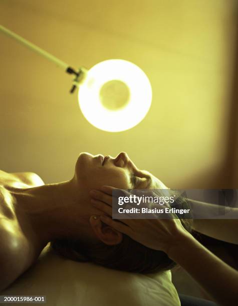 woman receiving facial, close-up, profile - facial massage stock pictures, royalty-free photos & images