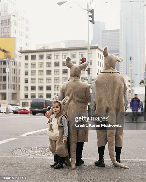 family wearing kangaroo costumes, downtown seattle, usa - quirky family stockfoto's en -beelden