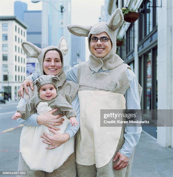 family dressed in kangaroo costumes, downtown seattle, usa - friendly match stockfoto's en -beelden