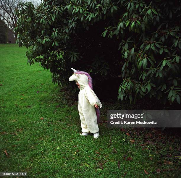 girl (2-4) wearing unicorn costume in park - tomato_response stock pictures, royalty-free photos & images