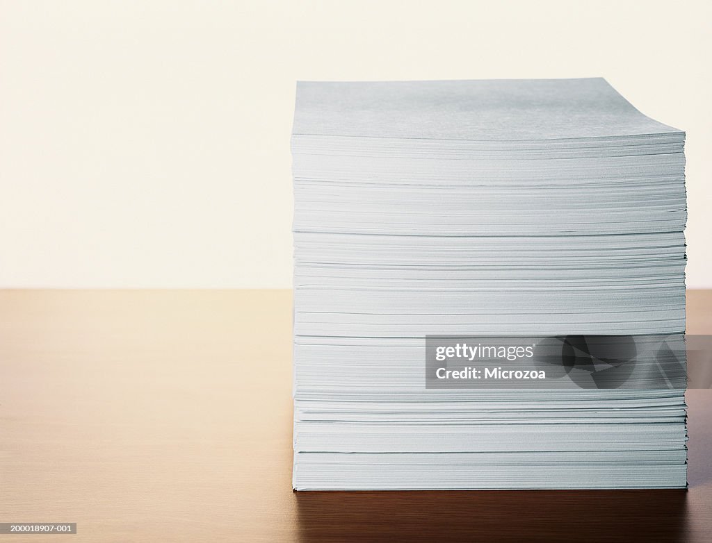 Stack of paper on table, close-up