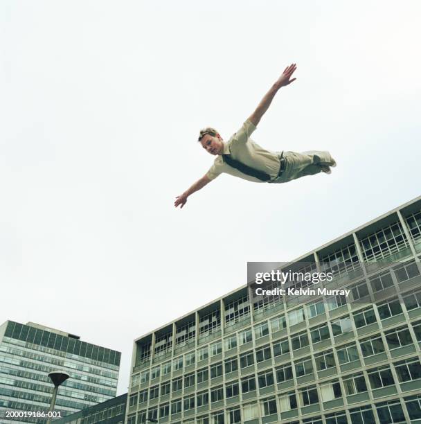 businessman in mid air, arms outstretched - dive stock pictures, royalty-free photos & images