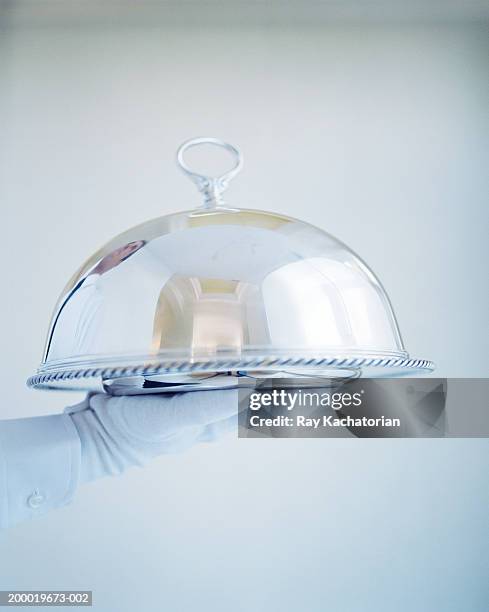waiter wearing white gloves holding silver tray - eleganter handschuh stock-fotos und bilder