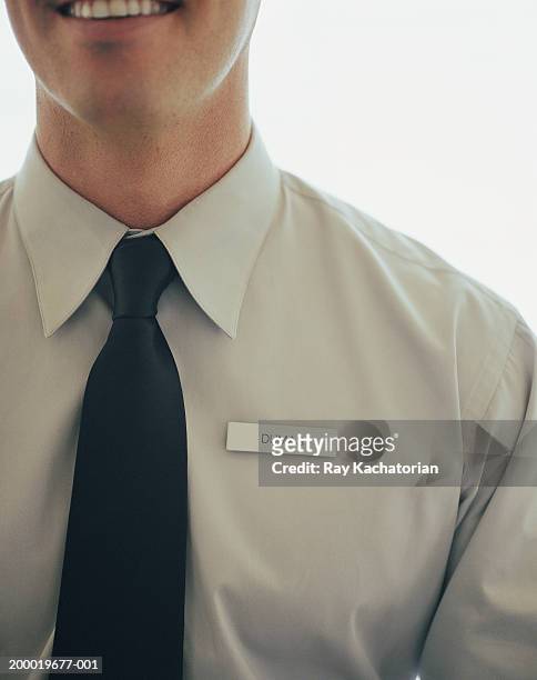 man wearing name tag - shirt tag stock pictures, royalty-free photos & images