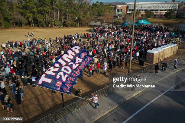 In an aerial view, supporters of Republican presidential candidate, former U.S. President Donald Trump line up to attend a Get Out The Vote rally at...