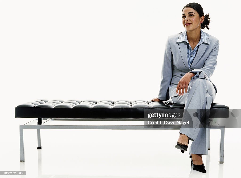 Businesswoman sitting on bench