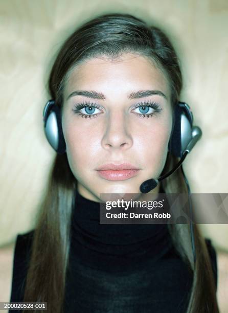 young woman wearing headset, portrait, close-up - long hair stock pictures, royalty-free photos & images